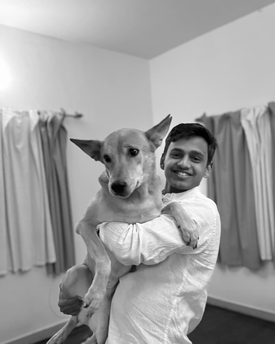 Vinayak, Wagly's founder, holding an indie dog